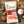 Load image into Gallery viewer, A bag of EPIC Hot and Spicy Pork Rinds around the ingredients that go in the product.